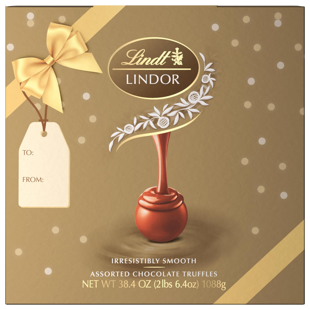 Lindt LINDOR caramel milk chocolate truffles, glossy shell and melt-in-mouth center.