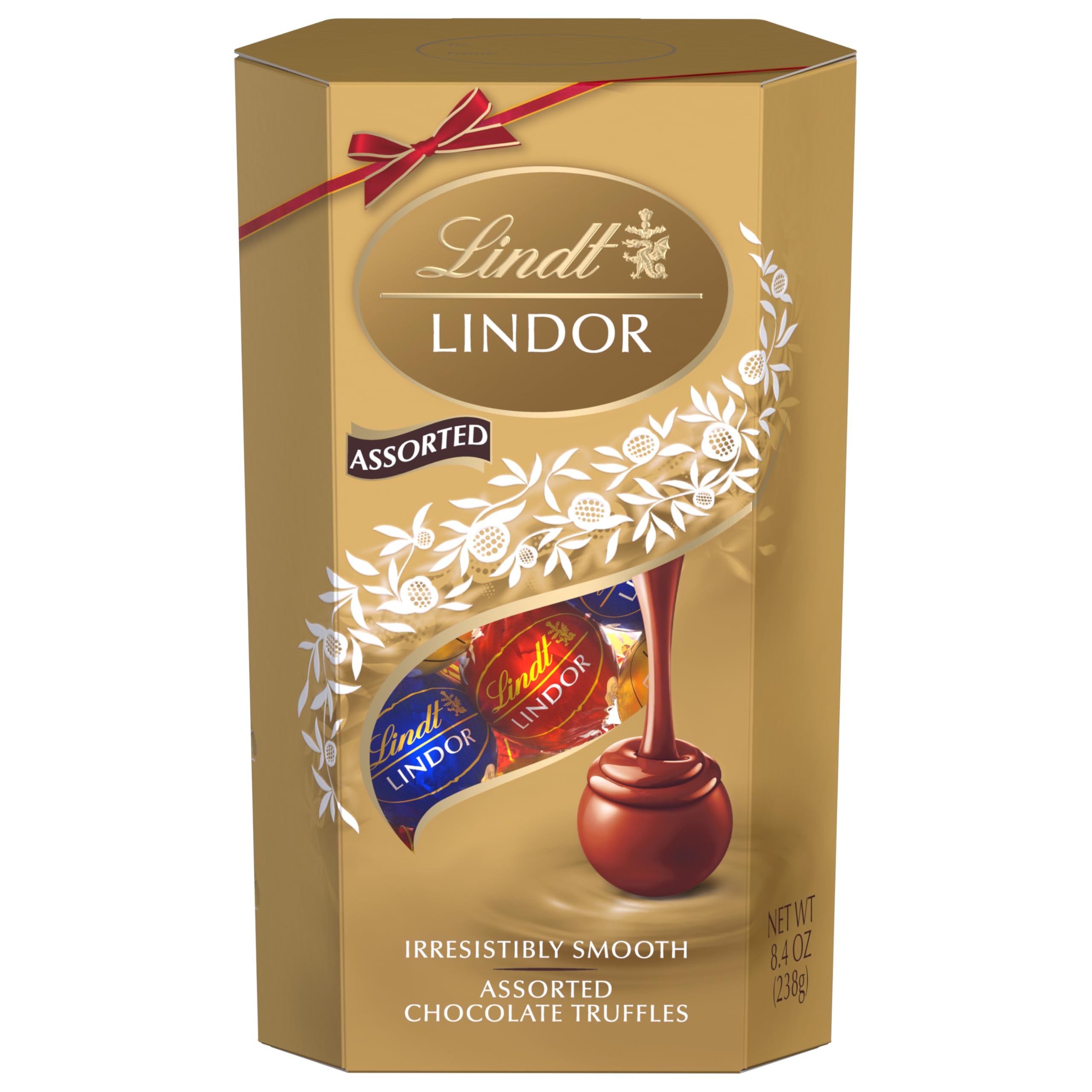 Lindt LINDOR premium artisan craftsmanship seal on box, conveying luxury gifting.