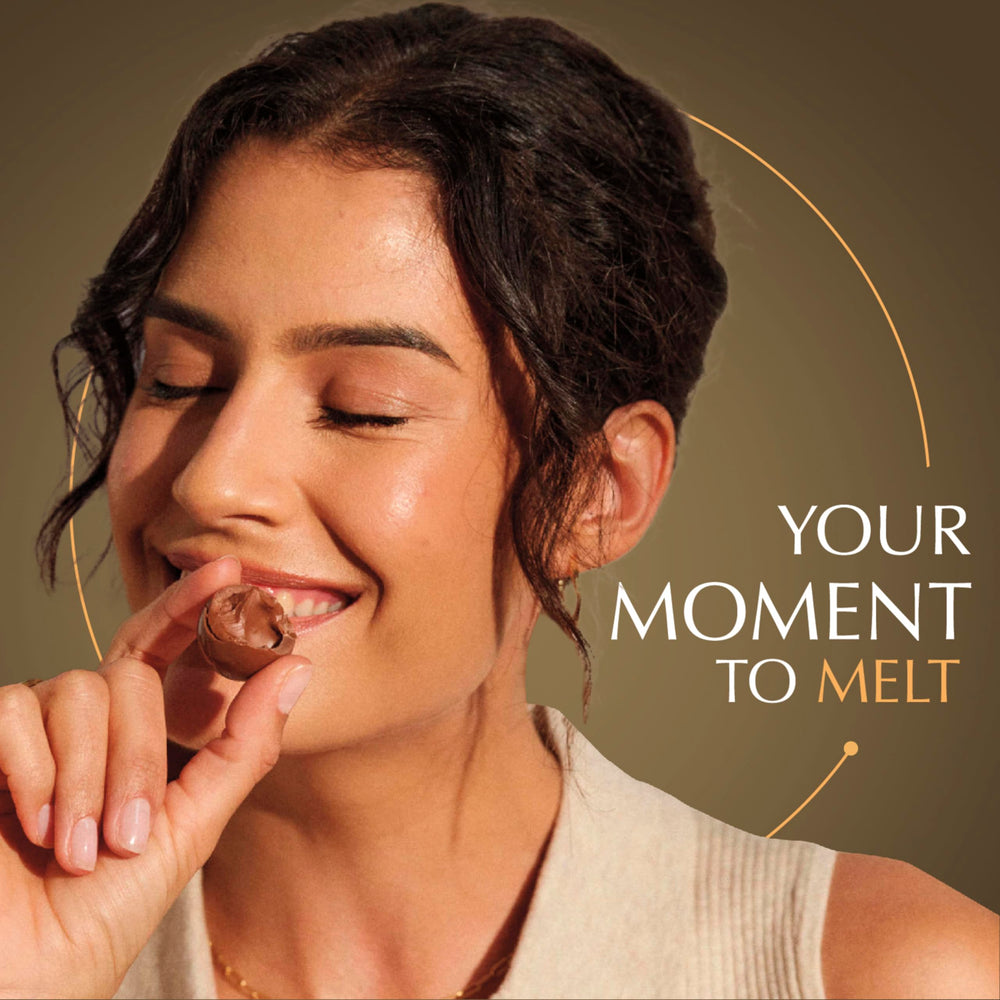 Lindt LINDOR dark chocolate truffle spotlight with rich cocoa flavor.