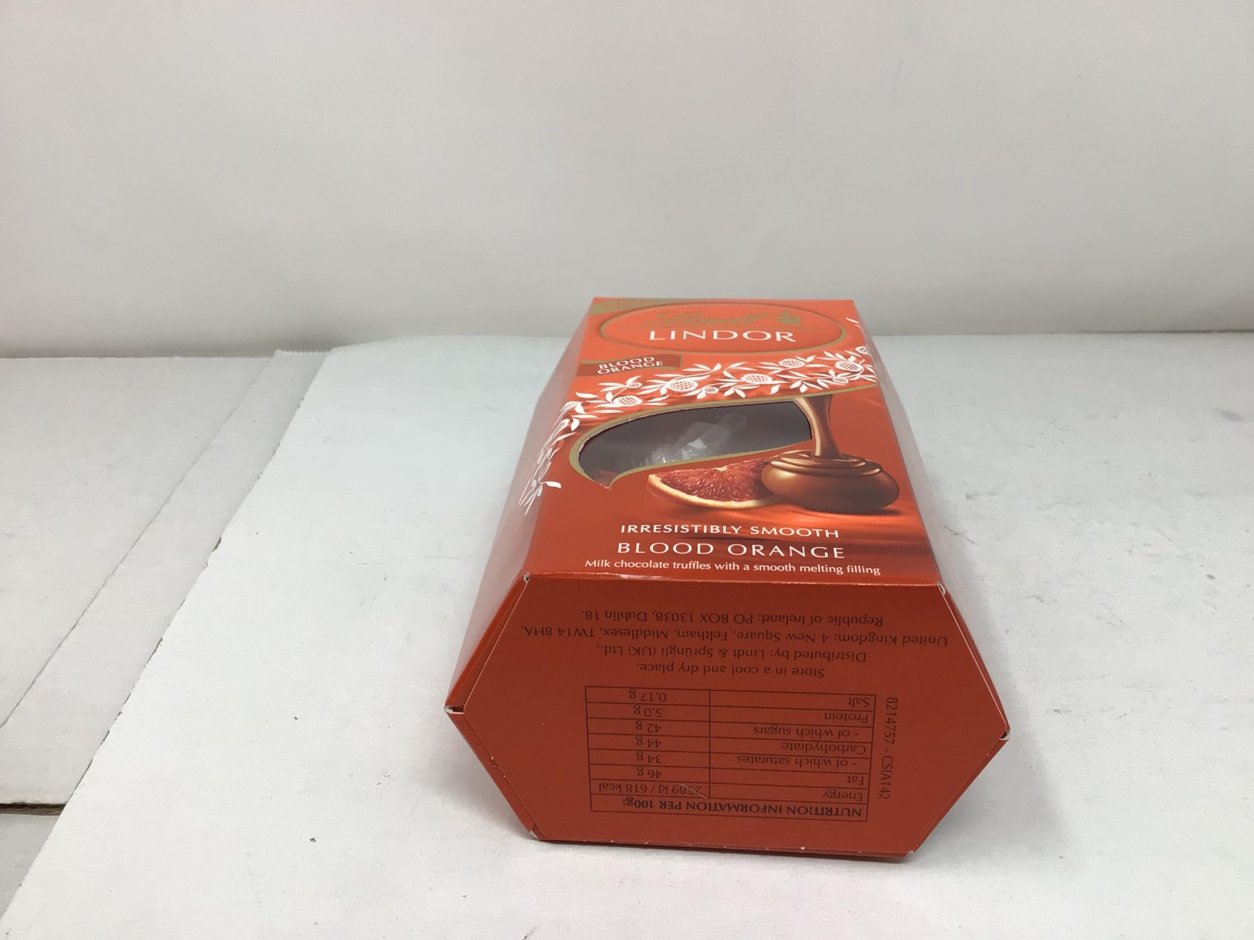 Lindt Lindor Milk Orange 200g dessert-ready on a dessert plate