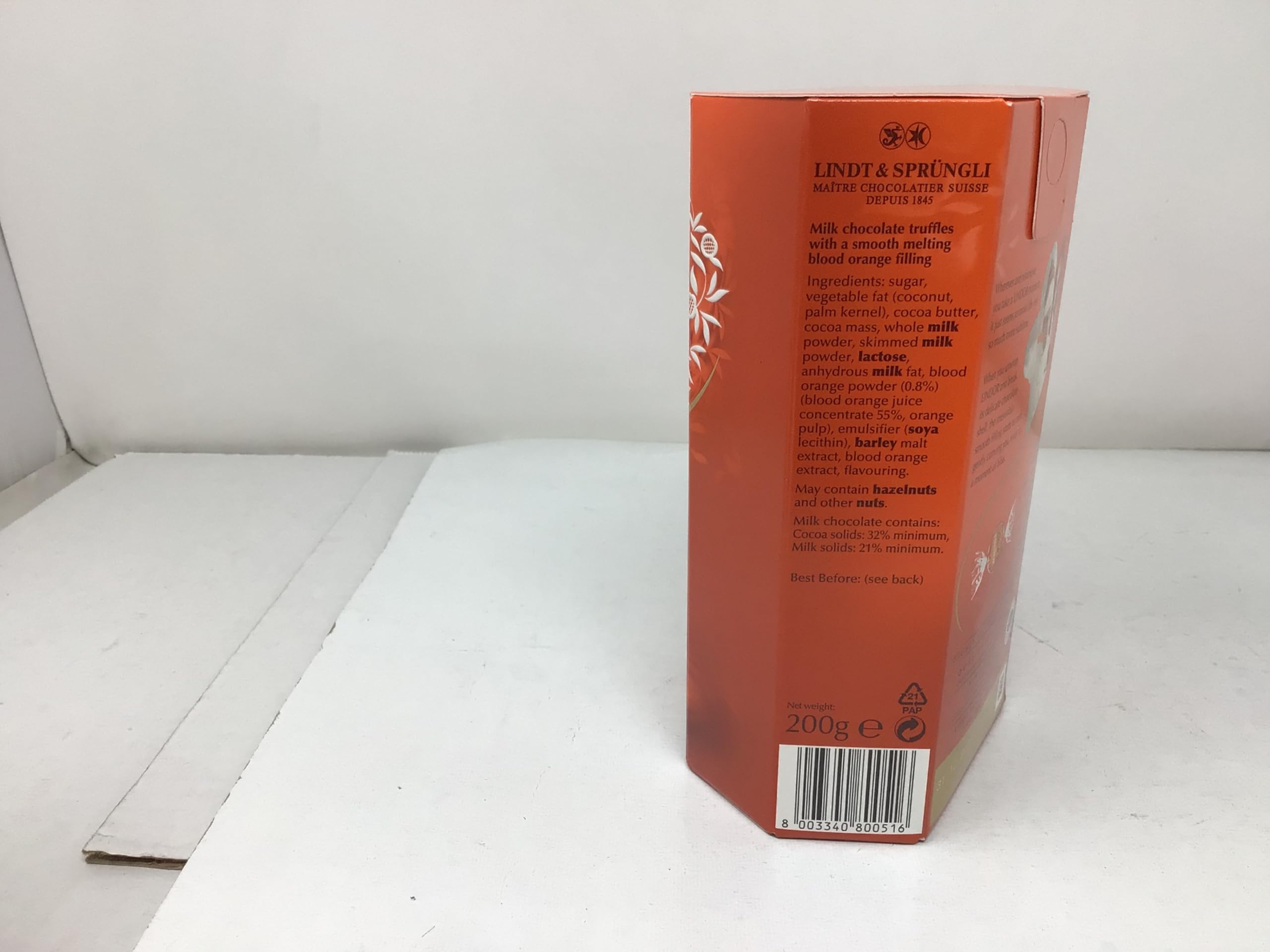 Lindt Lindor Milk Orange 200g melting-center close-up with creamy texture