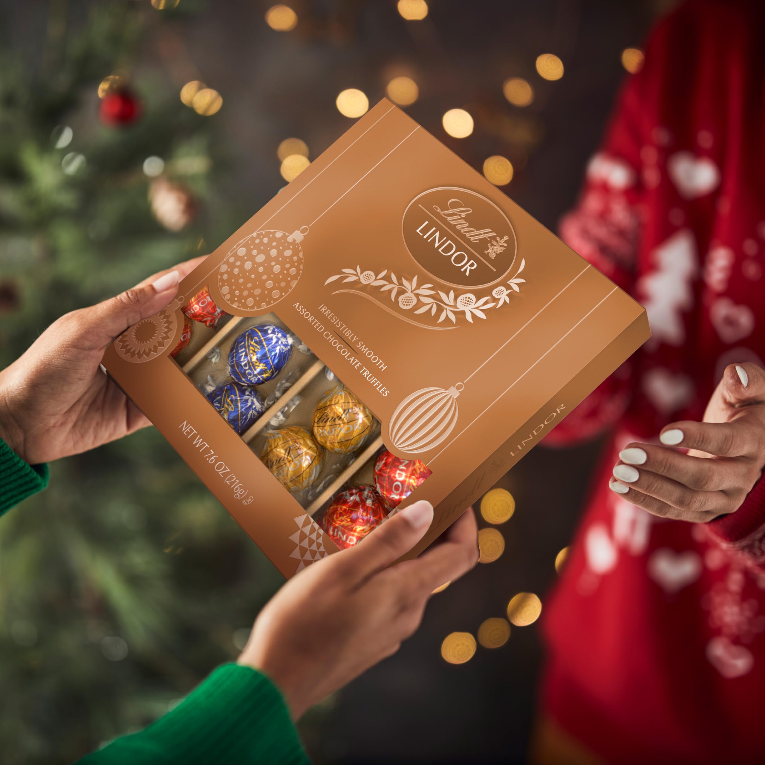 Lindt LINDOR truffle wrapper peeled open, ready to enjoy