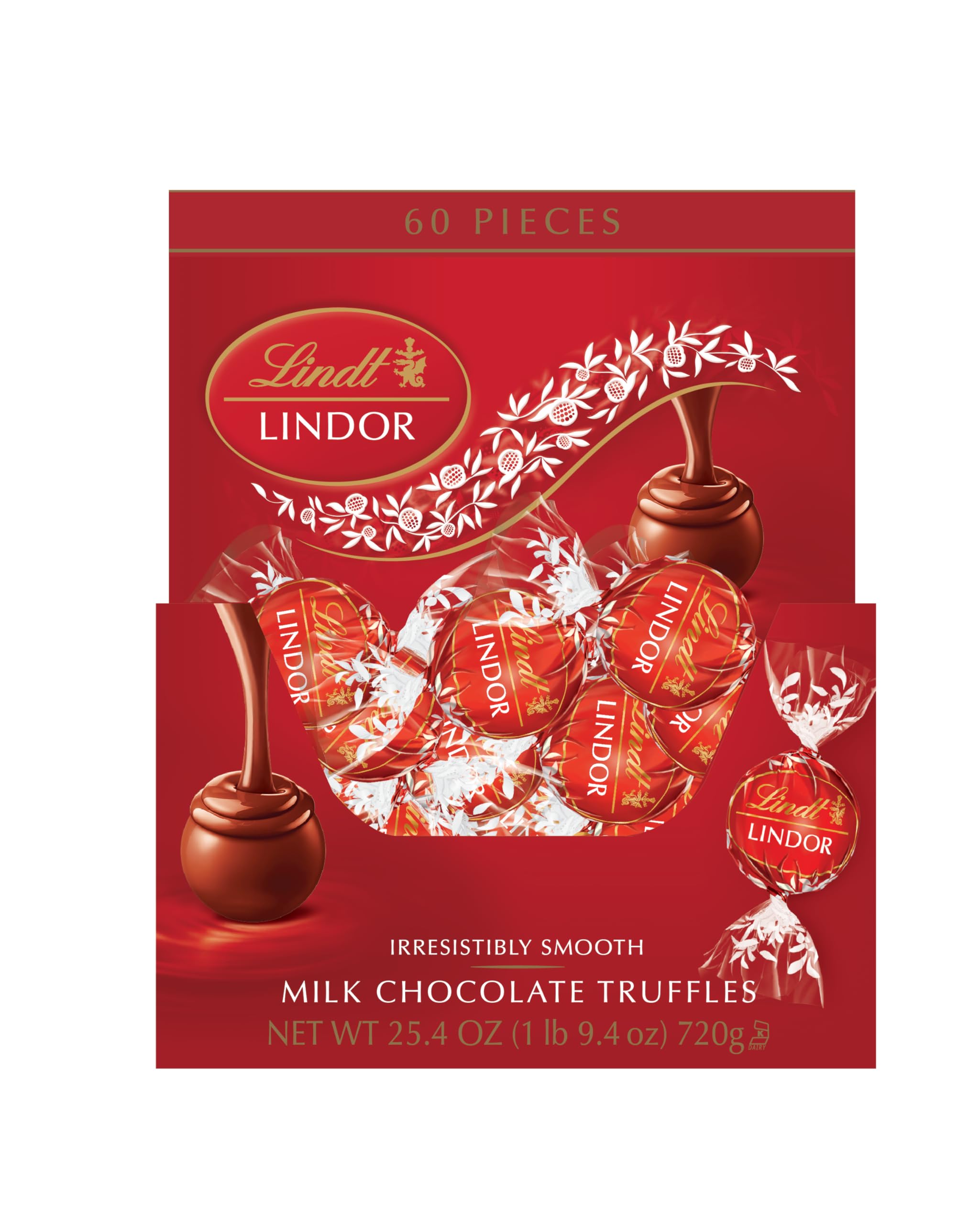 Lindt LINDOR truffles melting on tongue, showcasing creamy center.