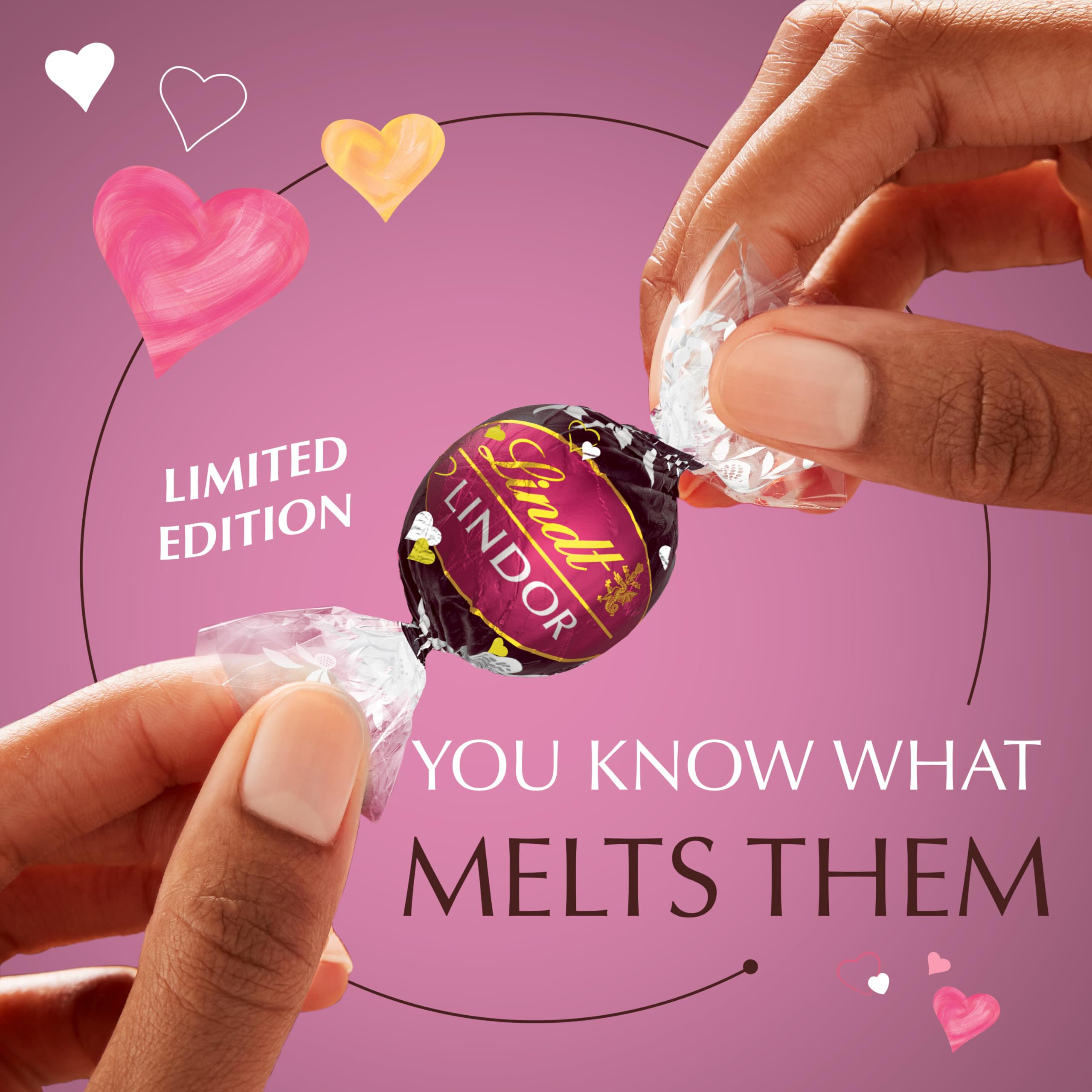 Lindt LINDOR Strawberry Heart gift box with rose petals, perfect date-night presentation.