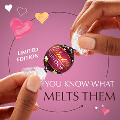 Lindt LINDOR Strawberry Heart gift box with rose petals, perfect date-night presentation.