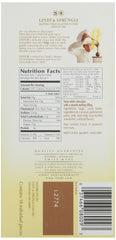 Lindt Lindor white bar bars stack shows premium cocoa sheen.