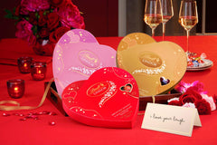 Lindt LINDOR truffles with delicate white chocolate shell and creamy strawberry filling