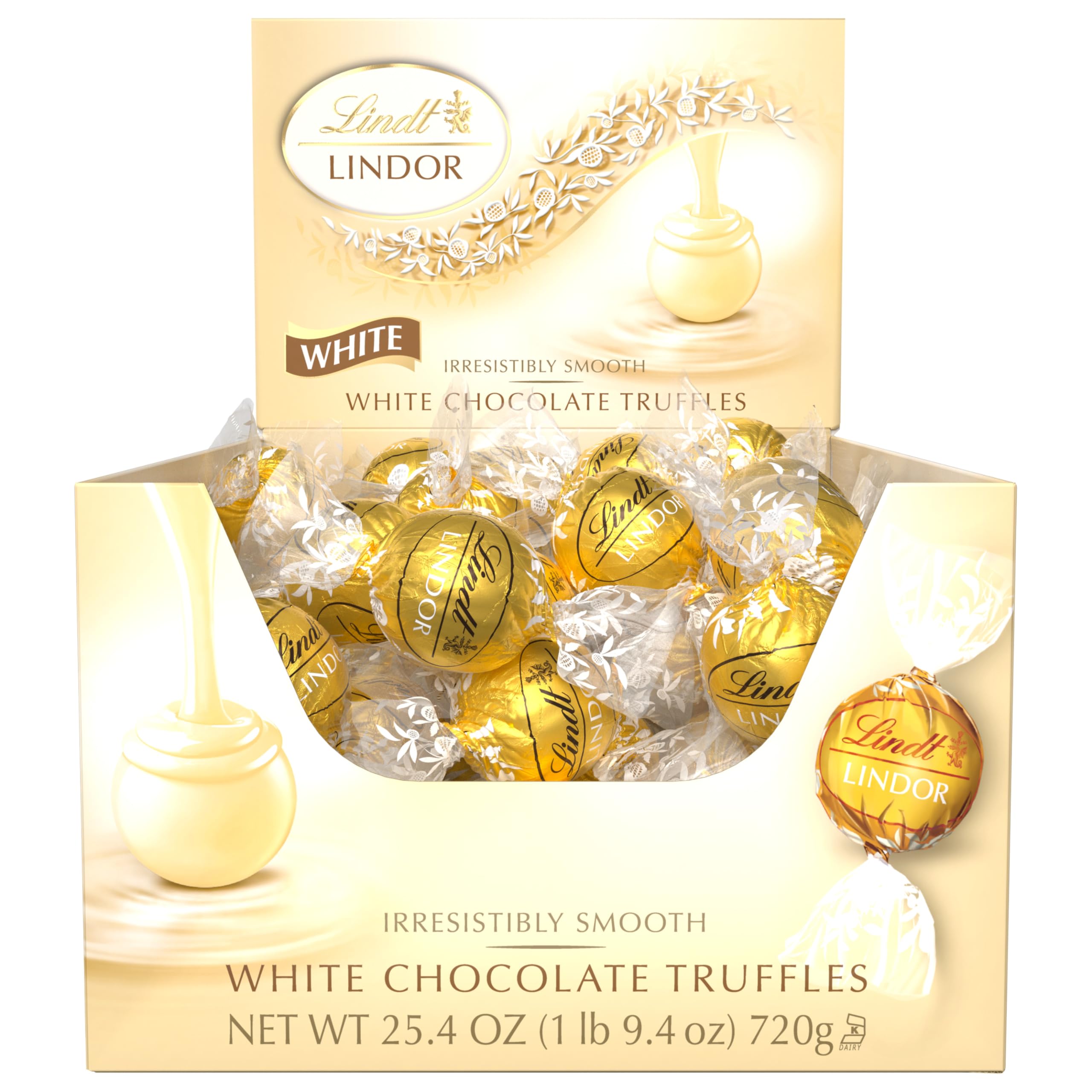 Lindt LINDOR White Truffles center cut reveals creamy interior.