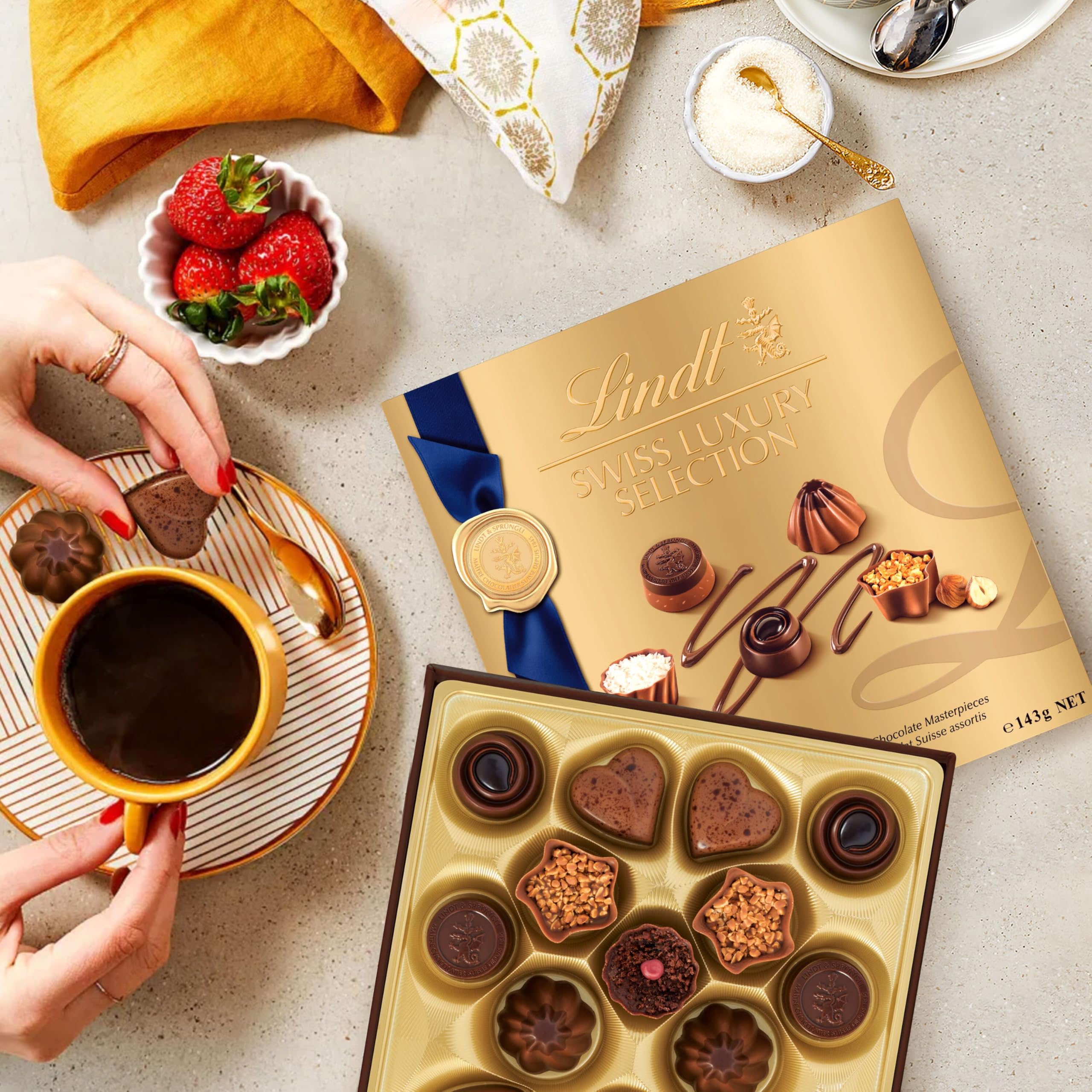 Lindt Swiss Luxury Selection gift box opened to reveal 14 chocolates for sharing