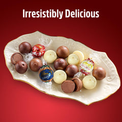 Lindt white peppermint truffles emphasize refreshing flavor and aromatic sweetness.