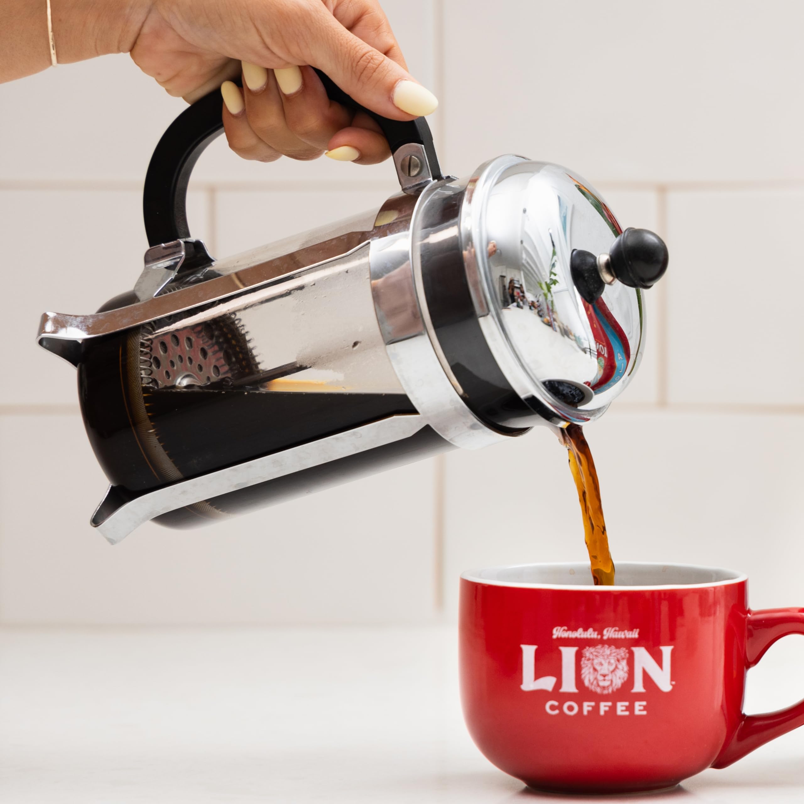 Lion Coffee Vanilla Macadamia steaming cup delivers warm, inviting aroma