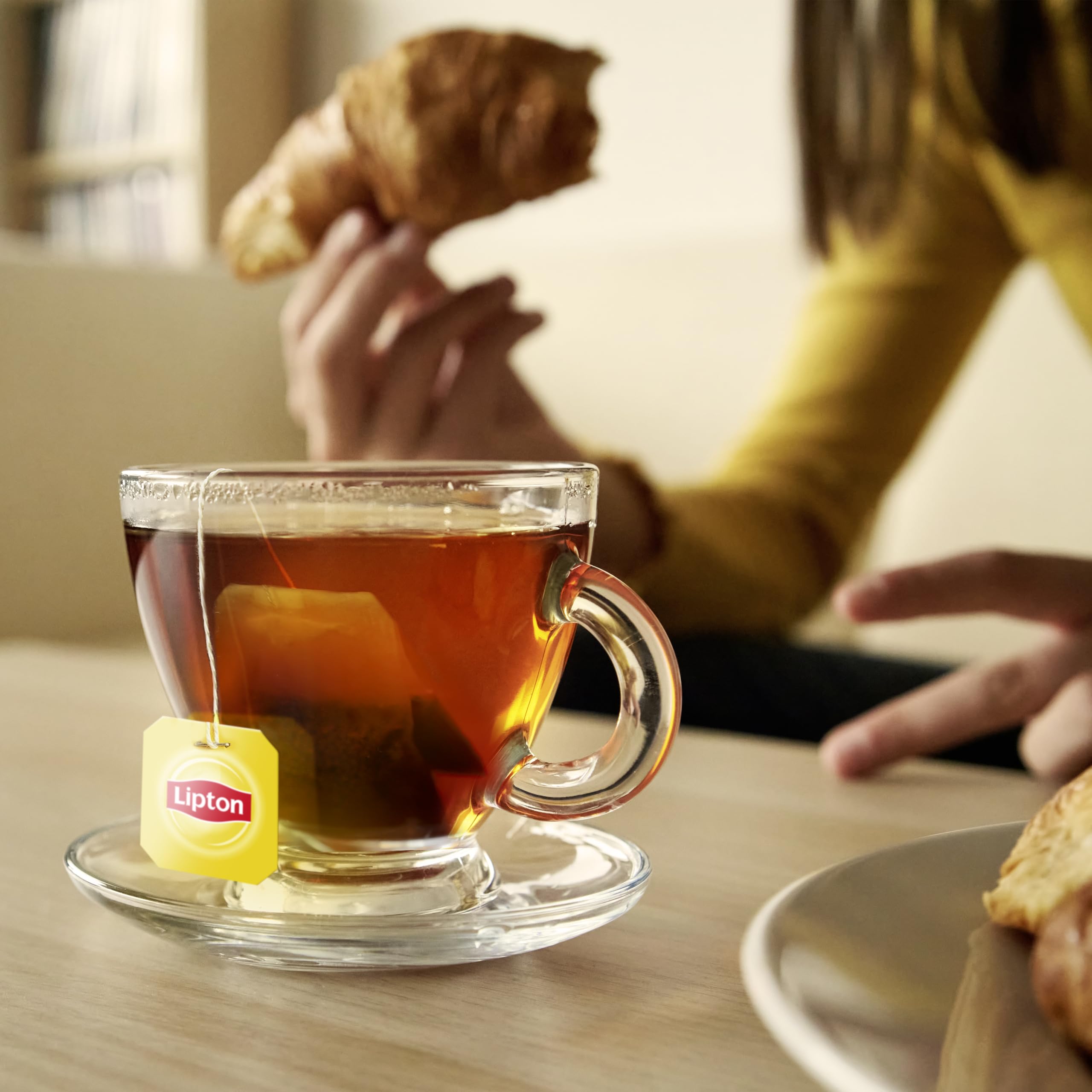 Brewing Lipton tea with a bag and hot water, simple at-home steps.