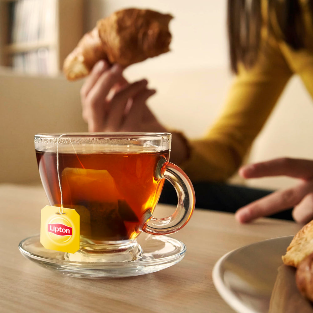 Brewing Lipton tea with a bag and hot water, simple at-home steps.