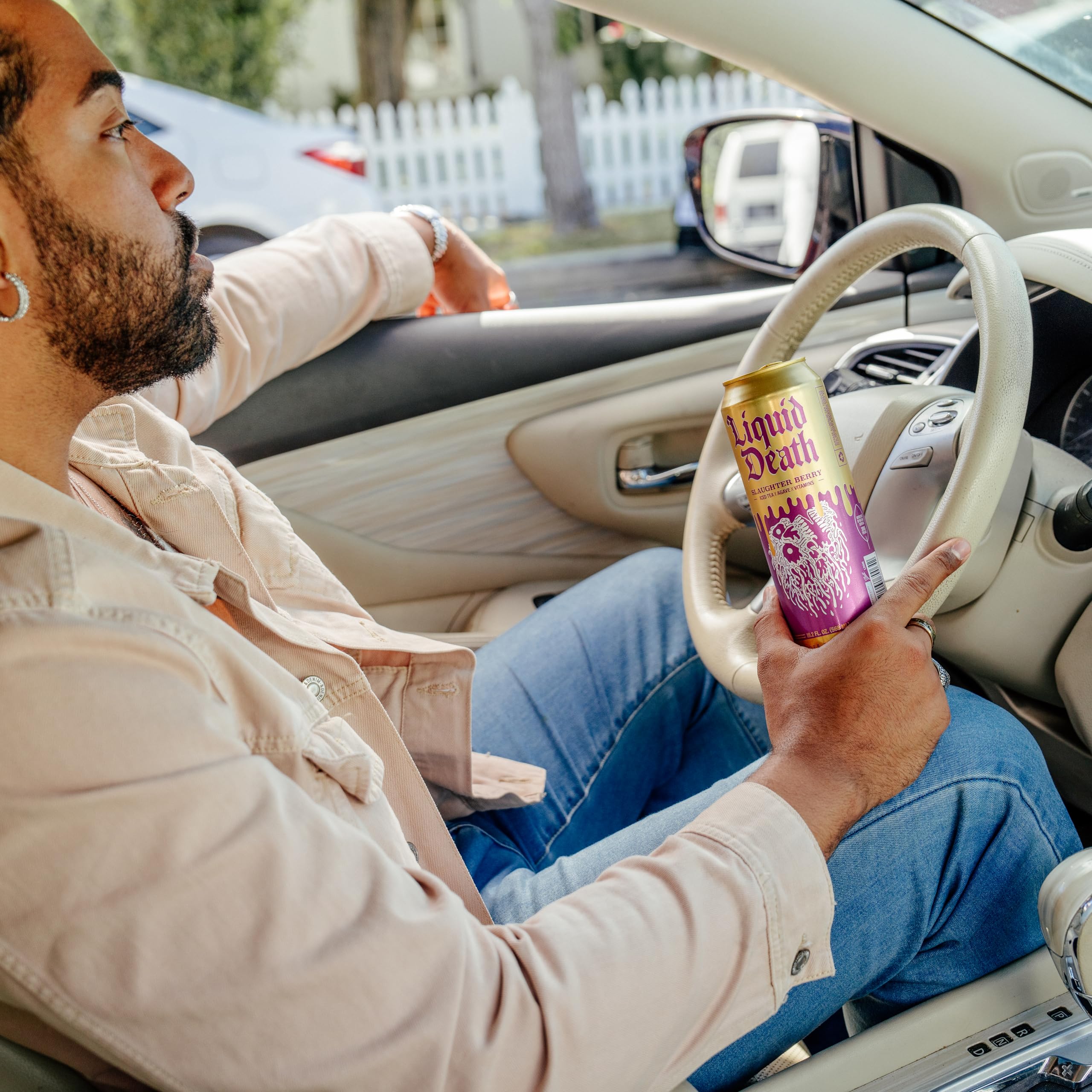 Liquid Death Slaughter Berry iced tea can showing natural caffeine boost for focus