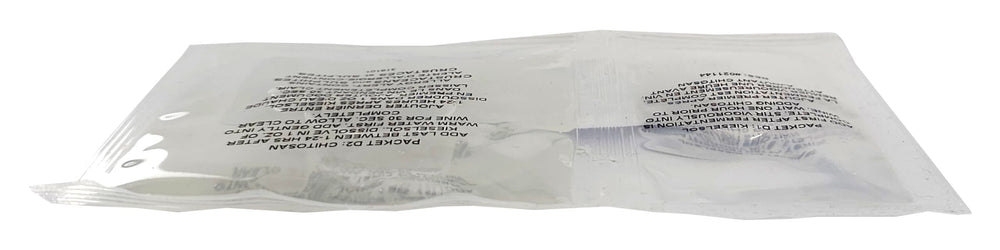 Liquor Quik finings being measured for precise 5–6 gallon treatment.
