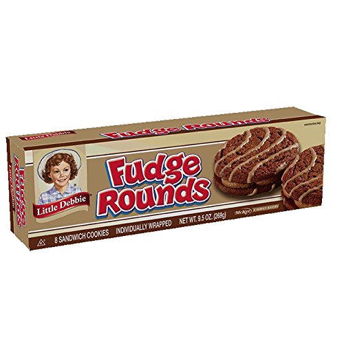 Little Debbie Fudge Rounds chocolate sandwich close-up highlighting creme layer.