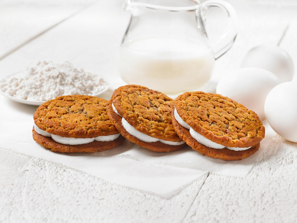 Oatmeal Creme Pies served with milk, ideal for a quick snack.