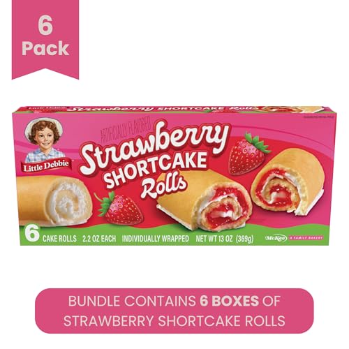 Little Debbie rolls closeup reveals creamy filling and strawberry layers for a tasty treat.