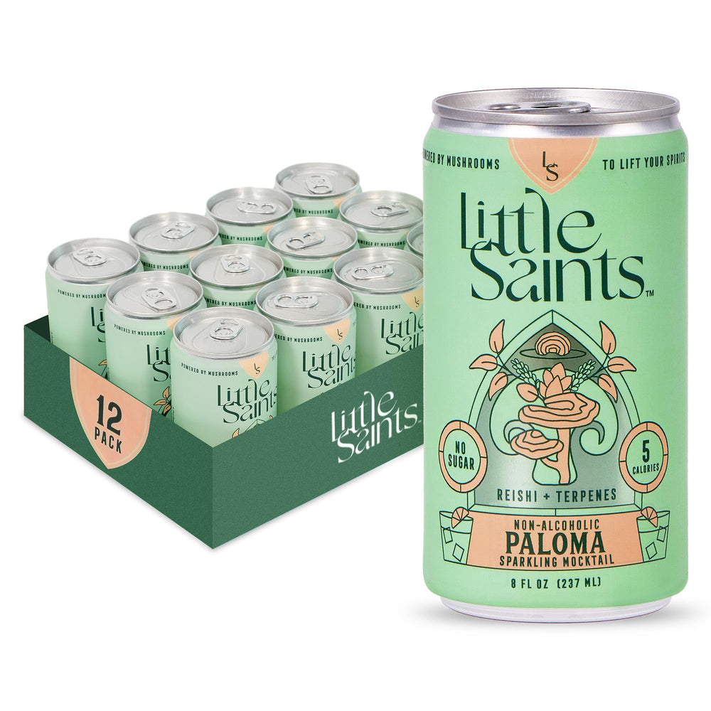Little Saints Paloma mocktails cans on a tray, zero sugar option for gatherings.