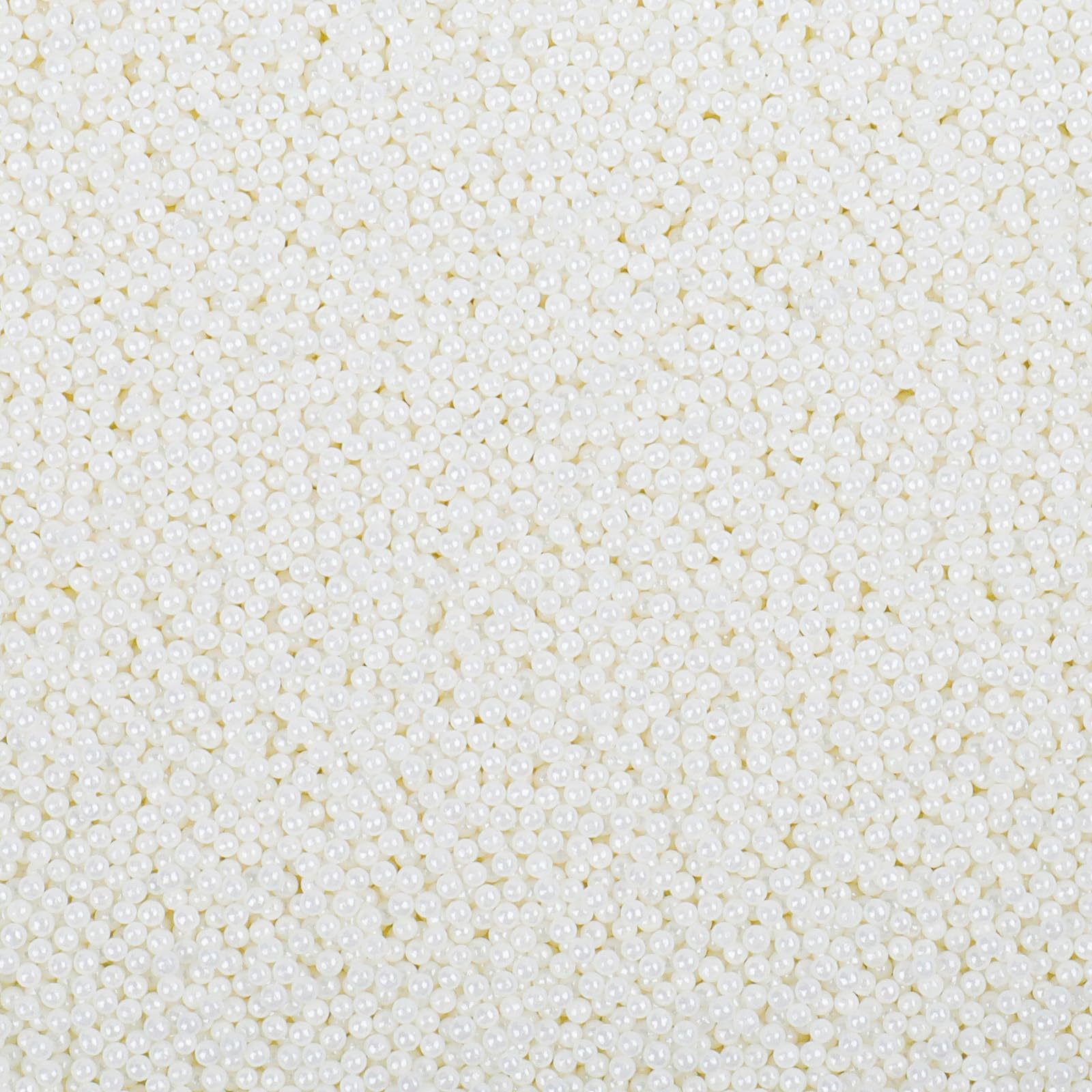 LittleStar white 2mm nonpareils sprinkled on frosted cake for a festive finish