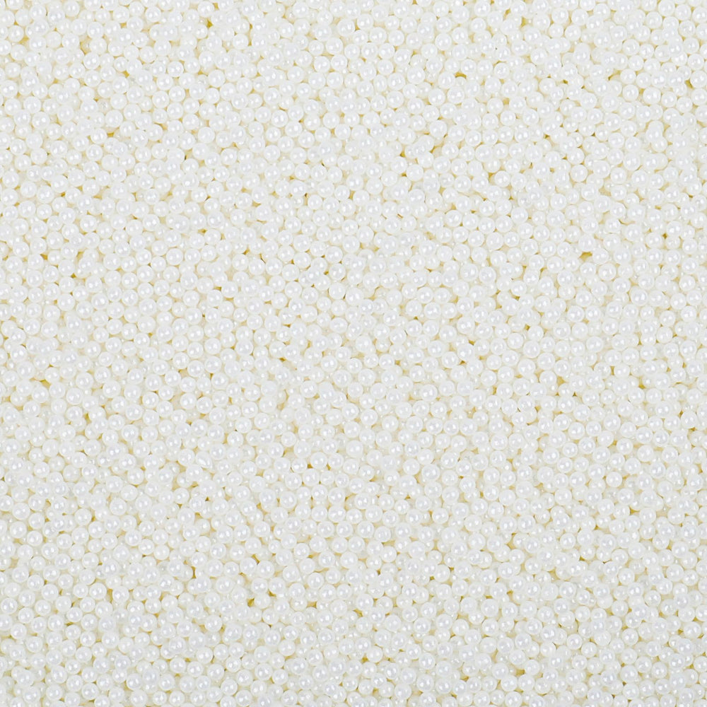LittleStar white 2mm nonpareils sprinkled on frosted cake for a festive finish