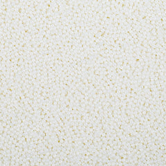 LittleStar white 2mm nonpareils sprinkled on frosted cake for a festive finish
