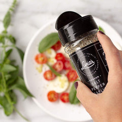 Close-up of Livia's Salt Pepper Garlic Seasoning showing kosher salt and garlic granules.