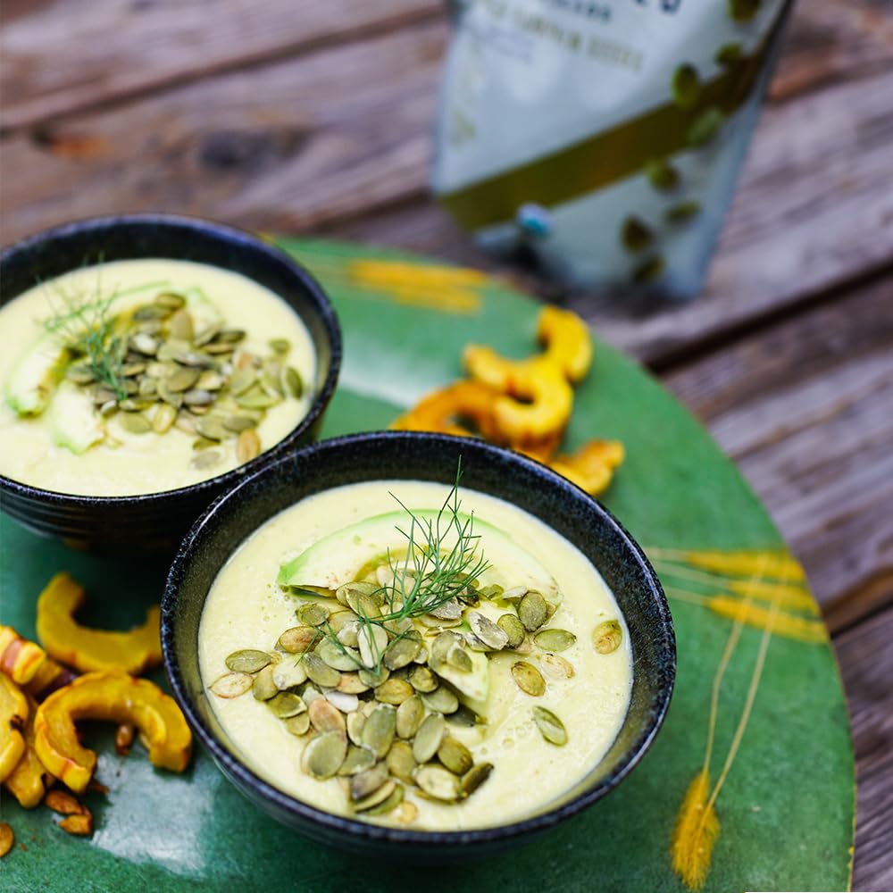 Living Intentions Organic Sprouted Pumpkin Seeds Salted with serving ideas, yogurt nearby.