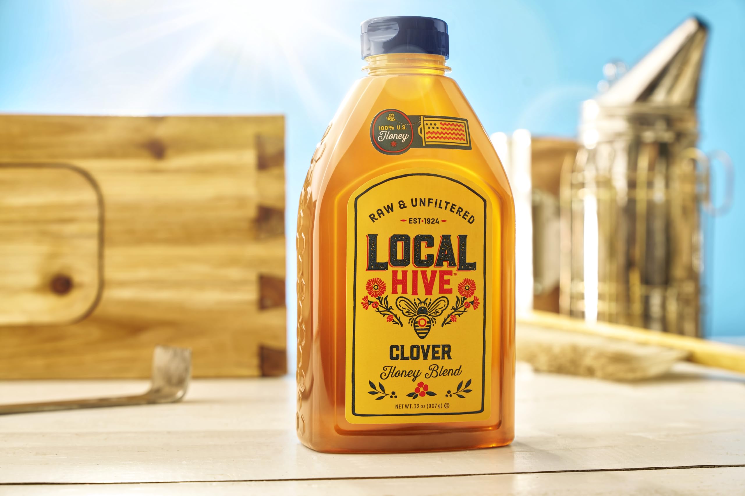 Pouring Local Hive Clover Honey into tea elevates natural sweetness.