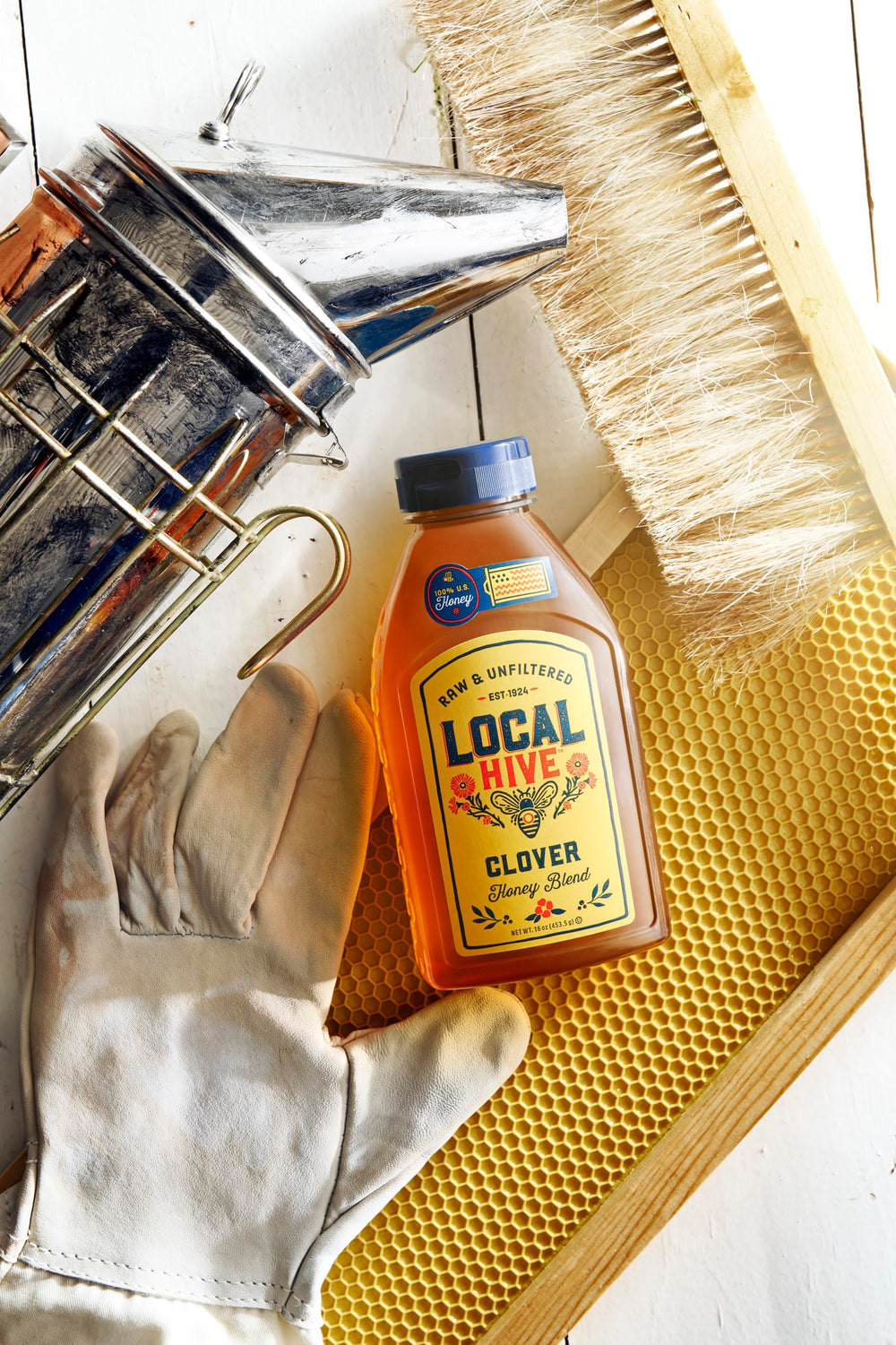 Local Hive Clover Honey label detail highlights 100% raw and unfiltered quality.
