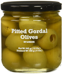 Losada pitted Gordal olives jar front view, ready to serve on a tapas board