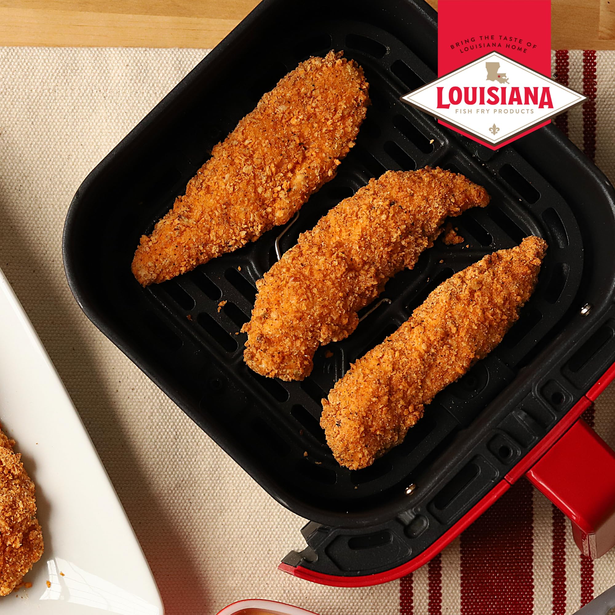Oven-ready tray with Louisiana Fish Fry coating mix for versatile cooking