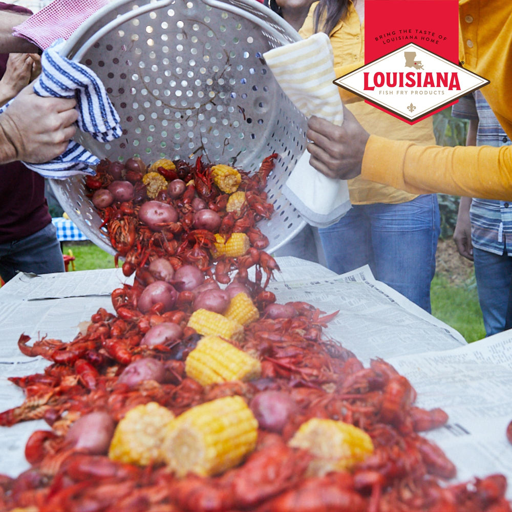 Louisiana Fish Fry Smashed Garlic Boil Booster packaging highlights low-salt claim.