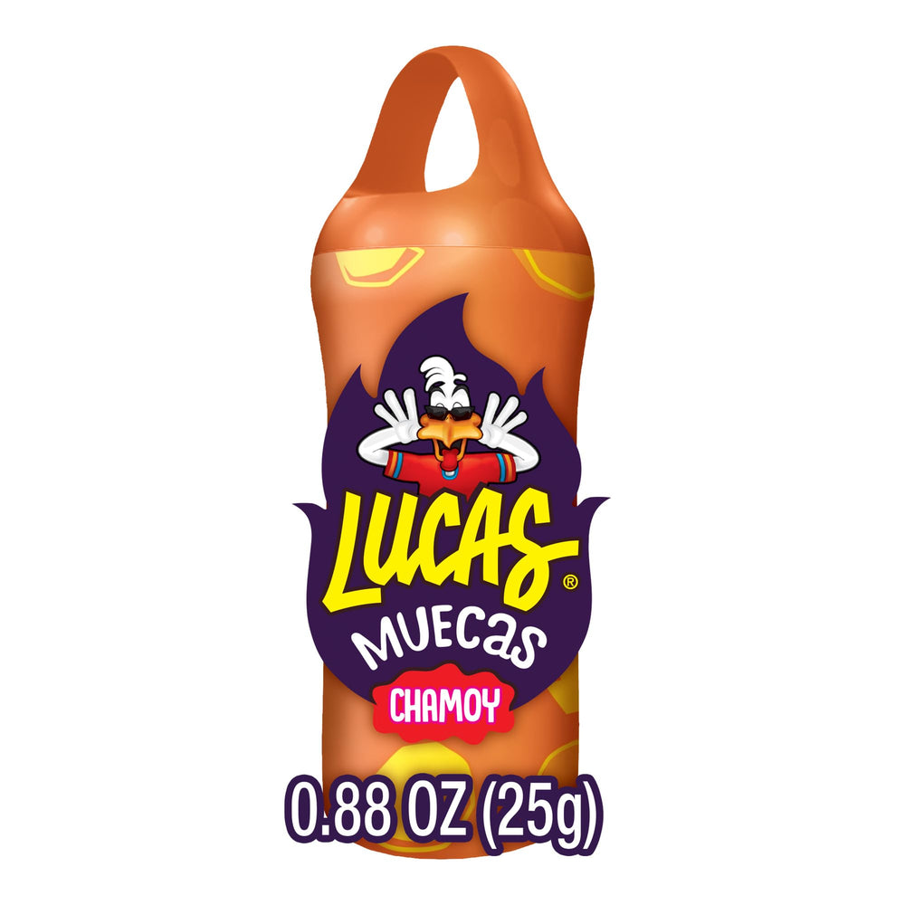 Close-up shows chili powder on Lucas Muecas Mango Lollipop for heat and flavor.