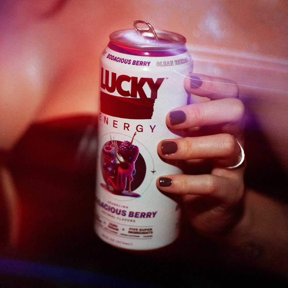 Lucky Energy Bodacious Berry being poured into a glass for quick focus