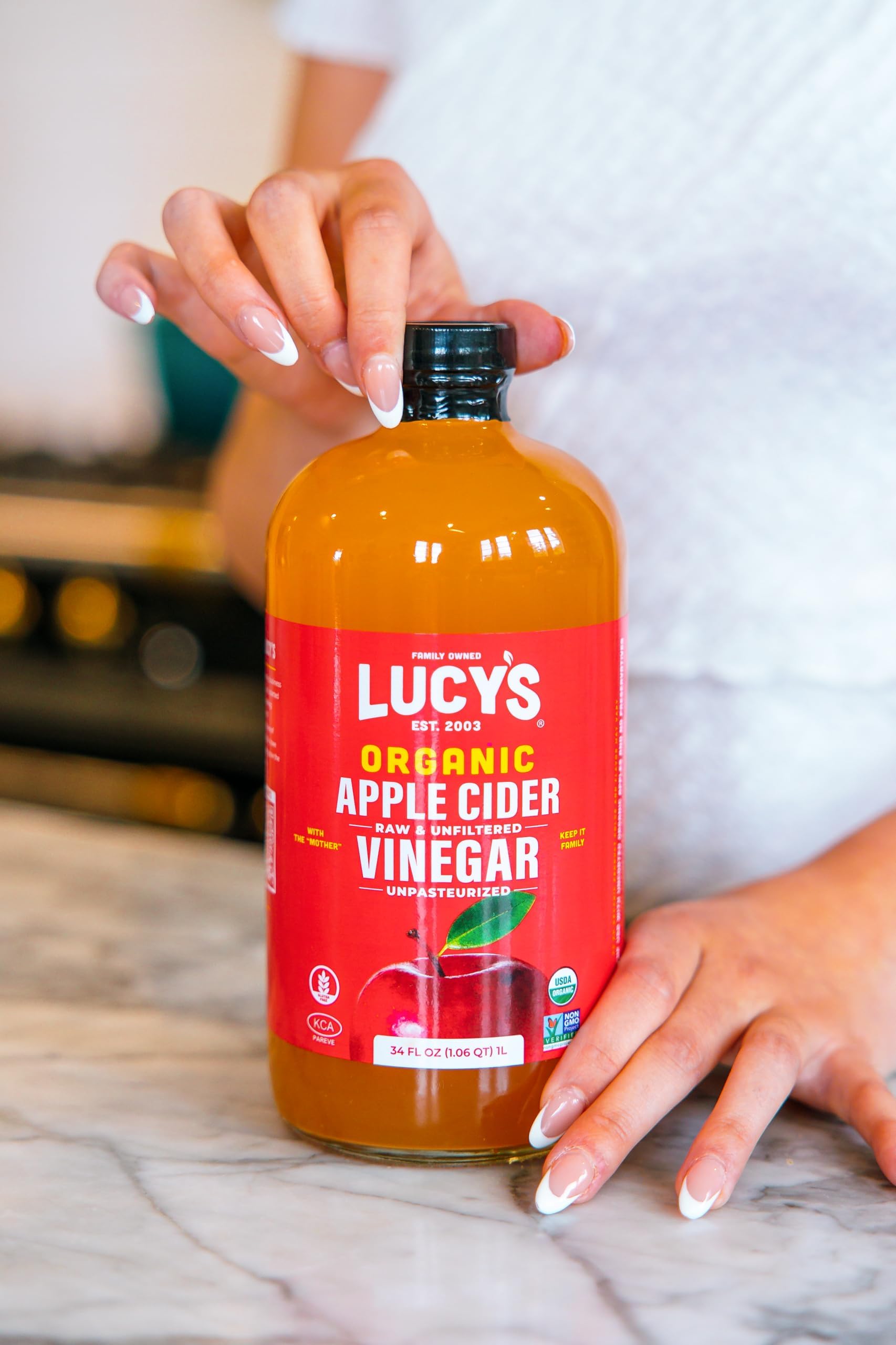 Lucy’s Organic Apple Cider Vinegar label emphasizes organic, unfiltered quality.