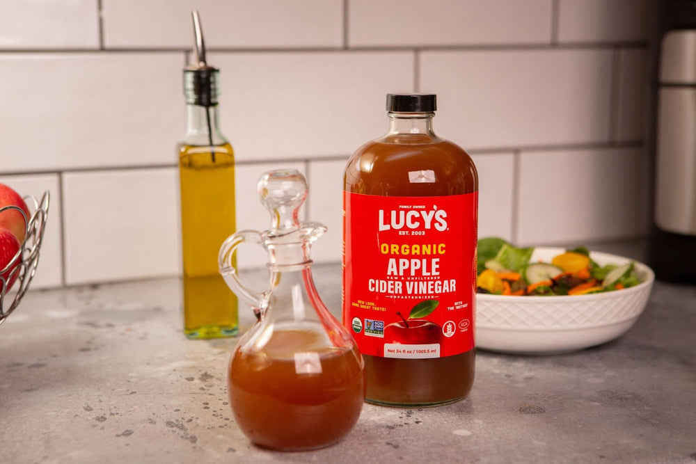 Lucy’s vinegar being poured hints easy mixing into recipes.