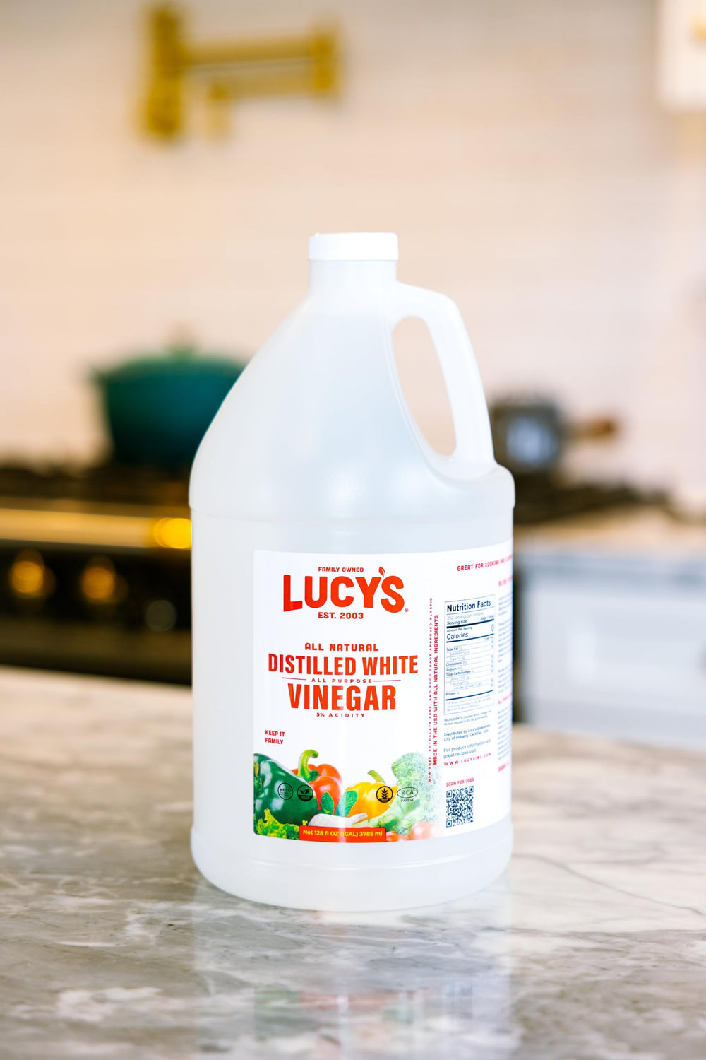 Lucy's White Vinegar family-origin label highlighting 2003 start.