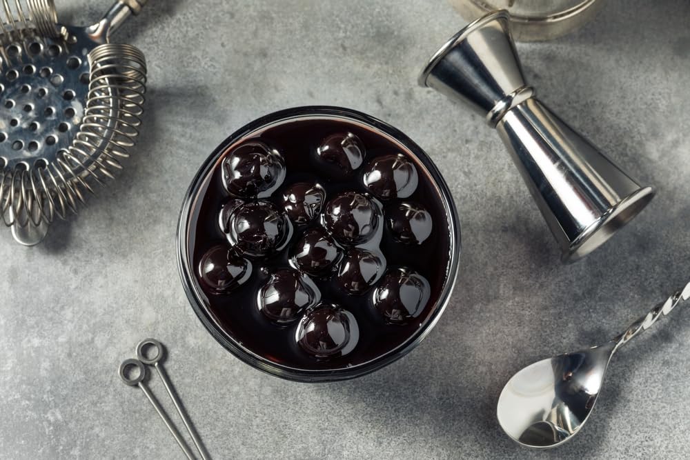 Luxardo cherries in a mixologist setup on bar