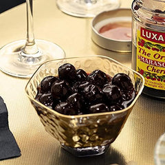 Luxardo Gourmet Maraschino Cherries on a cocktail glass, versatile garnish