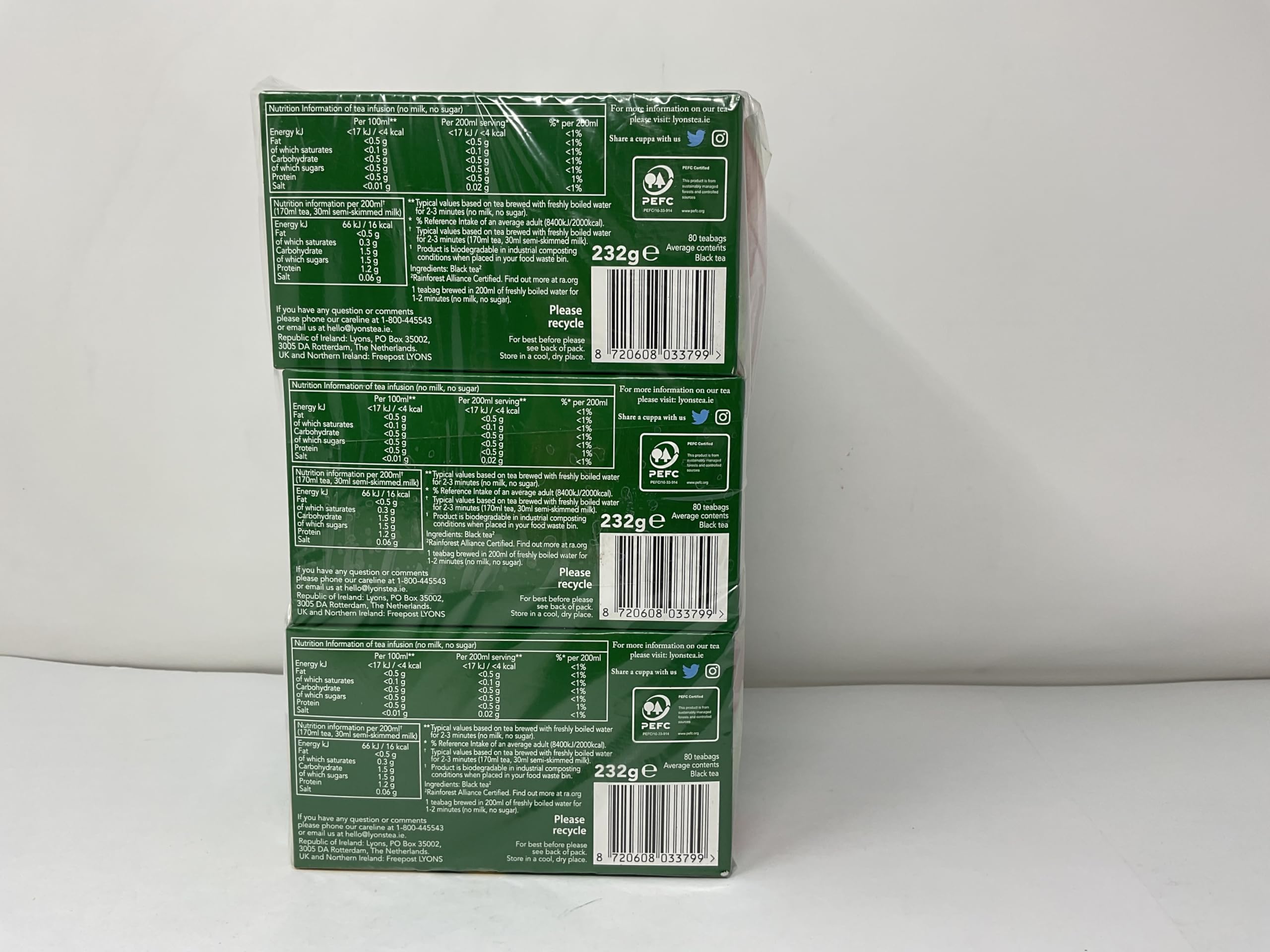 Lyons Original Blend tea bags with steaming cup suggest morning refreshment