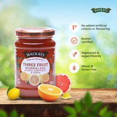 Mackays Marmalade 3 Fruit jar with wooden spoon on table