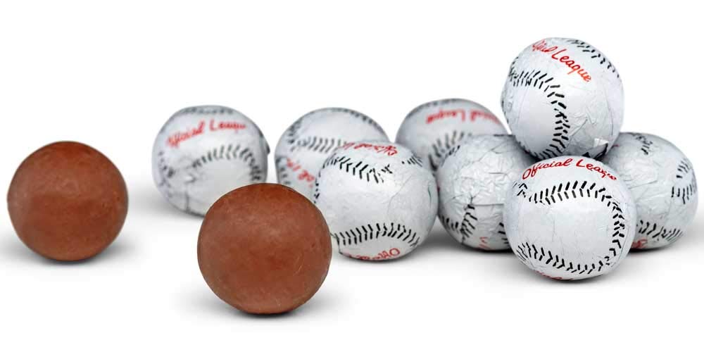 Premium milk chocolate baseball bites in elegant foil wrappers.