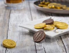 Gold-wrapped Madelaine coins ideal for St. Patrick's Day dessert tables.