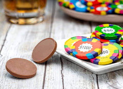 Madelaine Poker Chip Chocolates on party table for game-night celebrations.