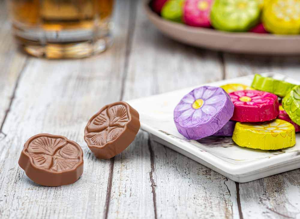 Madelaine premium milk chocolate in colorful daisy foil, perfect for special occasions.