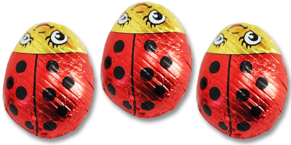 Red and black foil wrappers on Madelaine lady bugs for celebrations.