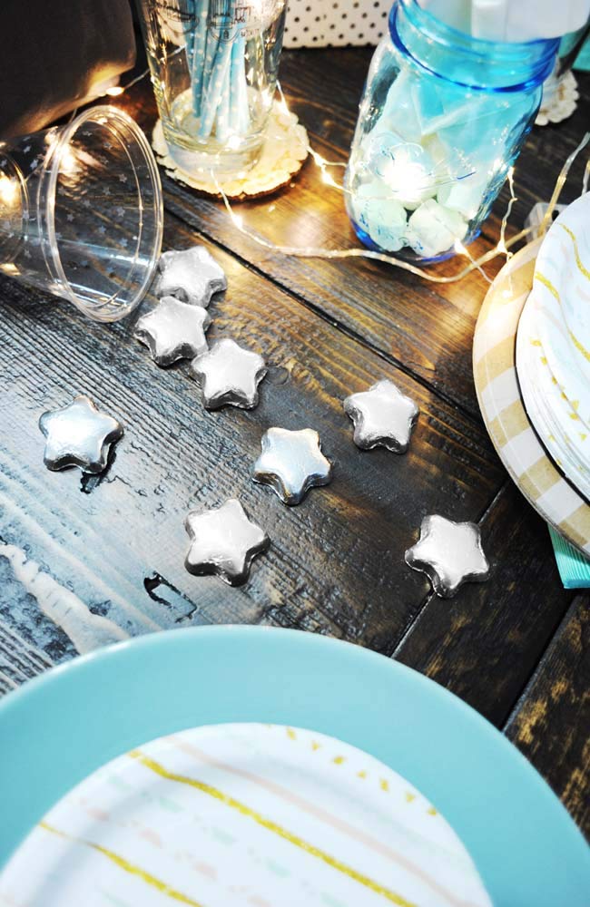 Madelaine Silver Stars displayed with Christmas stockings and decor