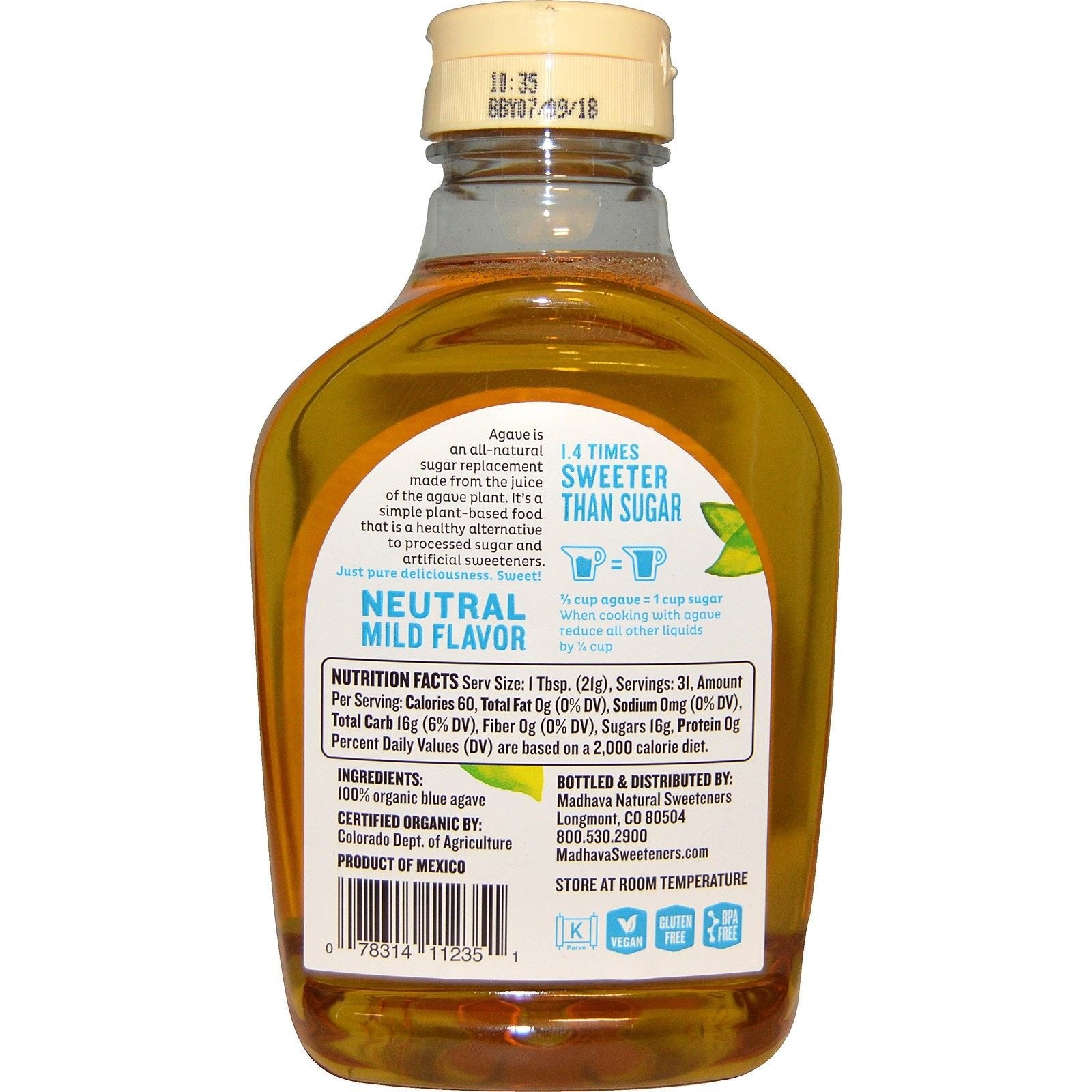 Madhava Organic Light Agave Nectar bottle on shelf, ideal for baking and topping.