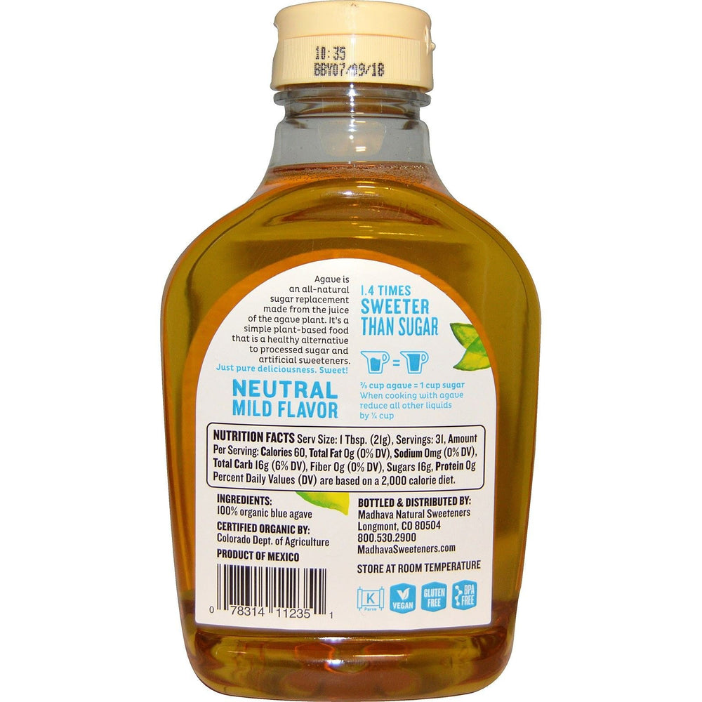 Madhava Organic Light Agave Nectar bottle on shelf, ideal for baking and topping.